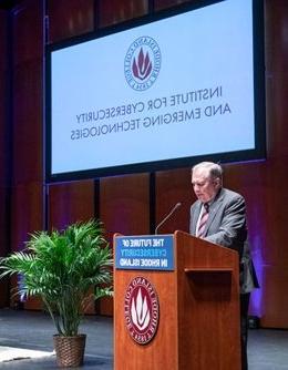 President Warner at podium during Institute for Cybersecurity and Emerging Technologies launch